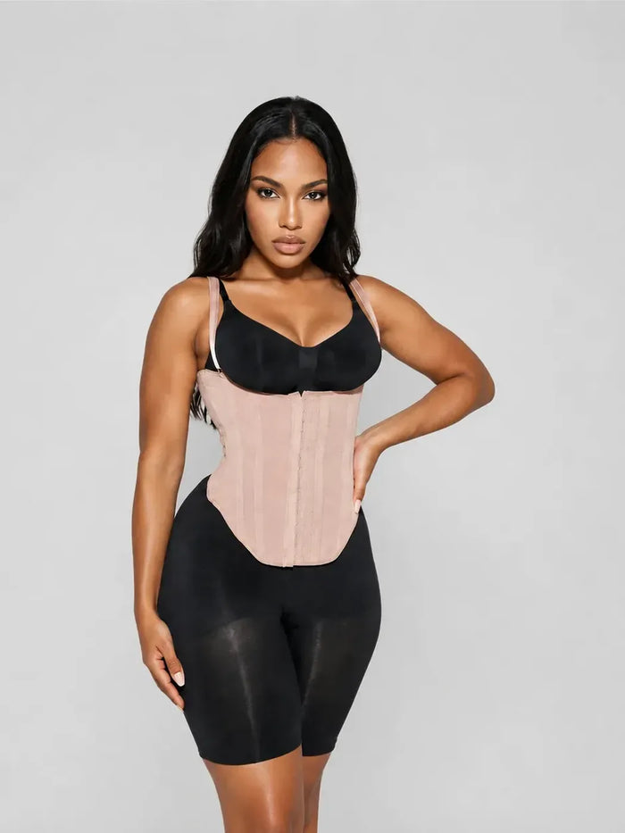 CYRA Sculpt Vest Waist Trainer in Sandstone โ front view on model, worn over a black bra and black shorts