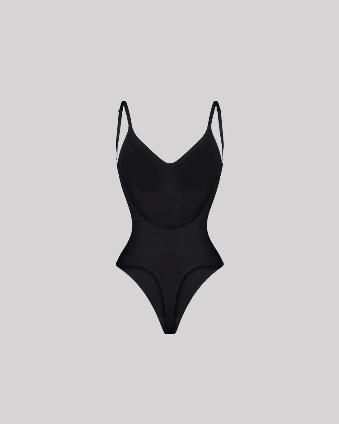 CYRA Bare-Back Sculpt Thong Bodysuit in Onyx — front view on model