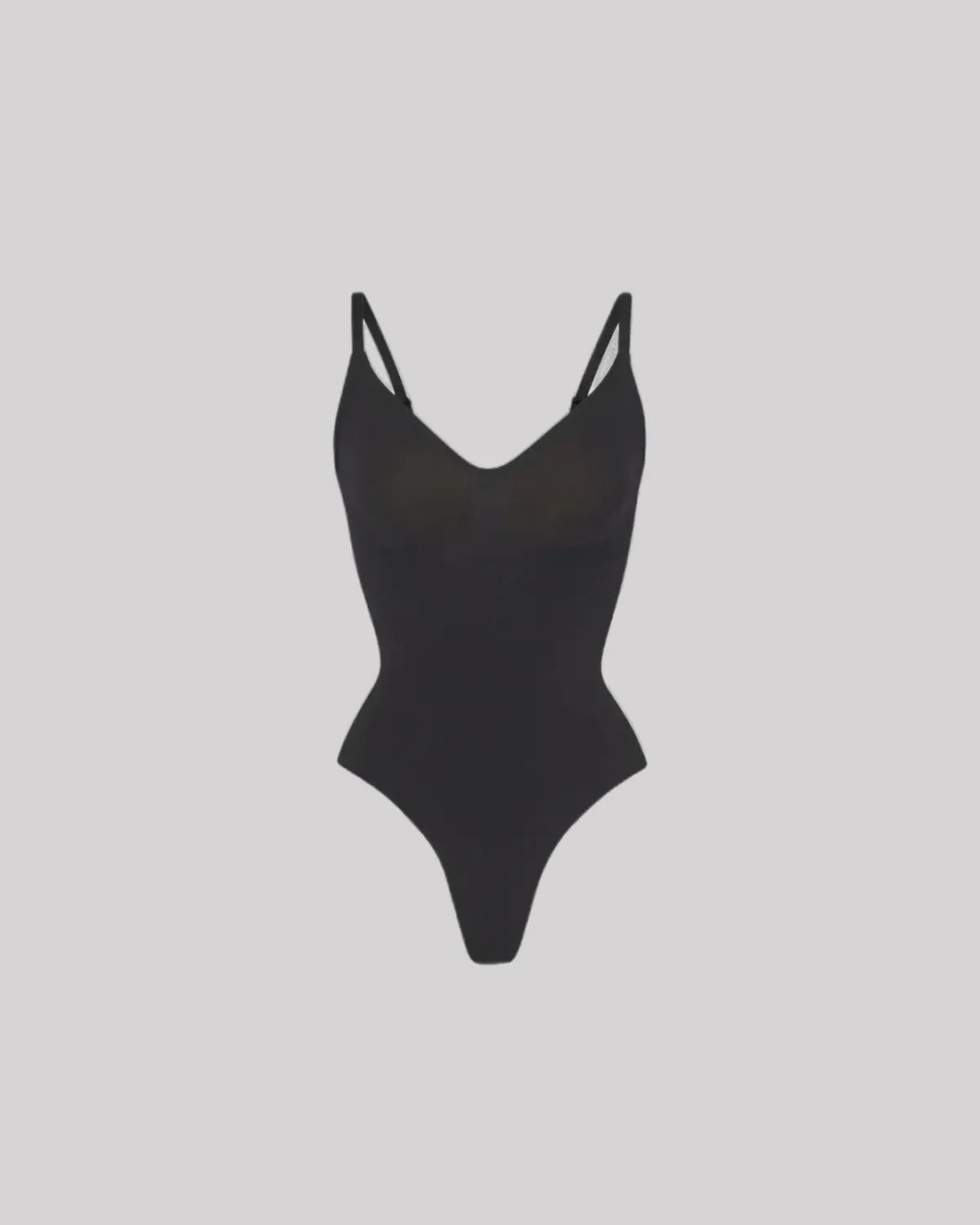 CYRA Sculpt Thong Bodysuit in Onyx — front view on model