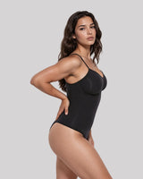 CYRA Sculpt Thong Bodysuit in Onyx — side view on model