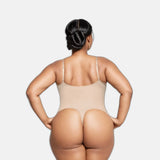 CYRA Sculpt Thong Bodysuit in Sandstone back view on a plus-size model