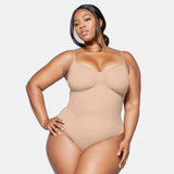 CYRA Sculpt Thong Bodysuit in Sandstone front view on a plus-size model